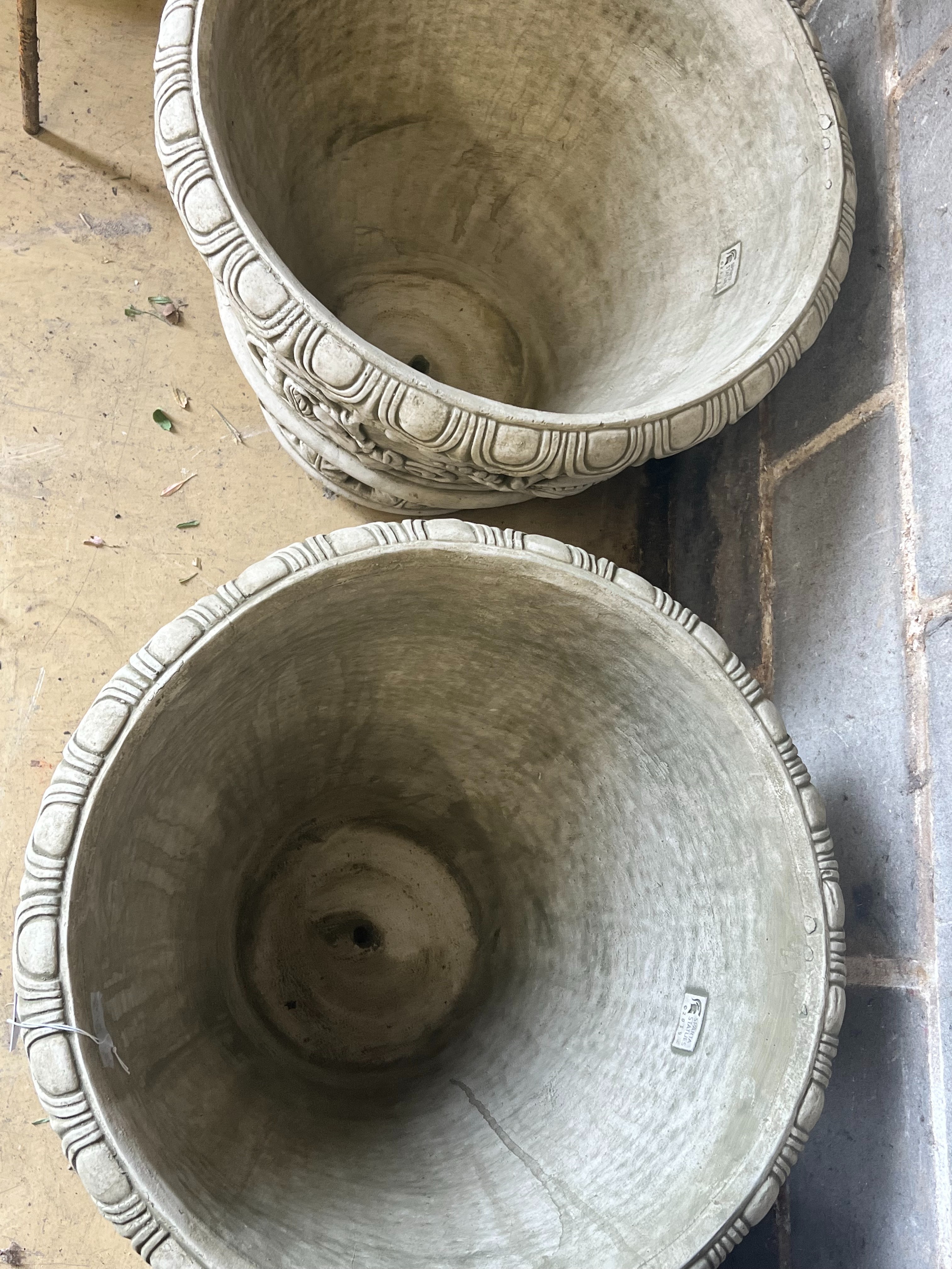 A pair of large reconstituted stone circular garden planters, diameter 55cm height 49cm